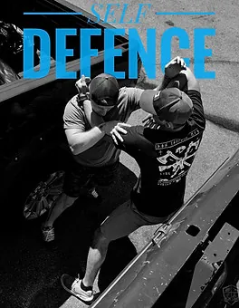 Coaches demonstrating a practical self defence scenario outdoors